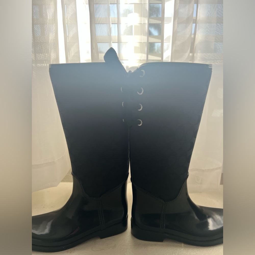 Lightly used rain coach boots